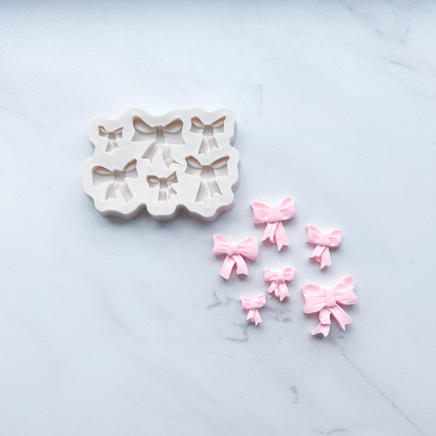 COQUETTE BOW MOLD
