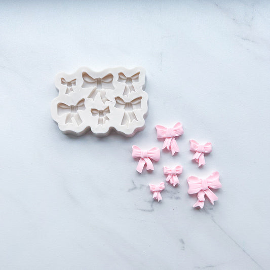 COQUETTE BOW MOLD